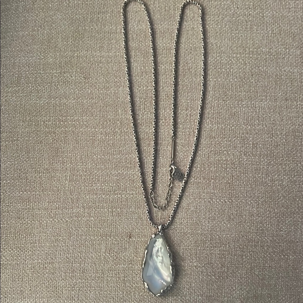 Beautiful Kendra Scott long chain with impressive 
Pearl like large stone.